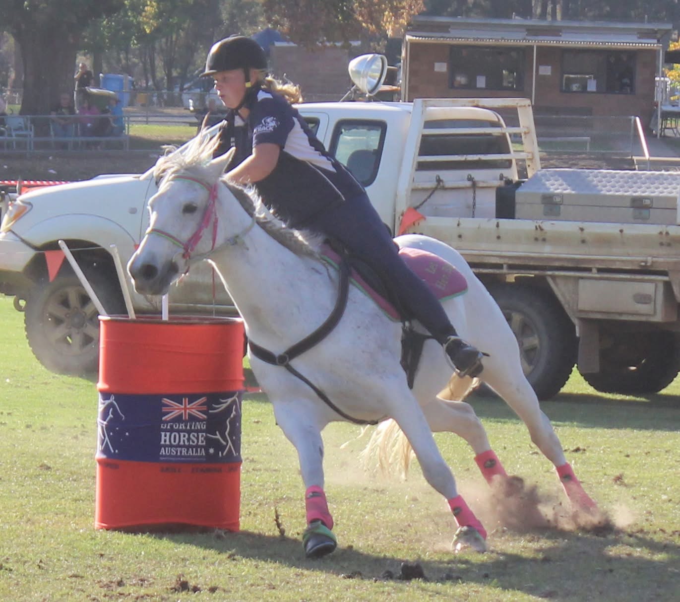 Junior rider rounding the barrel
